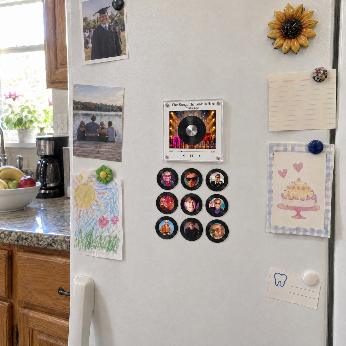 Glitter Keys music box and nine discs on a family fridge